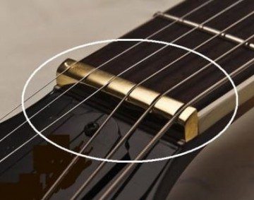 390   brass nut on guitar
